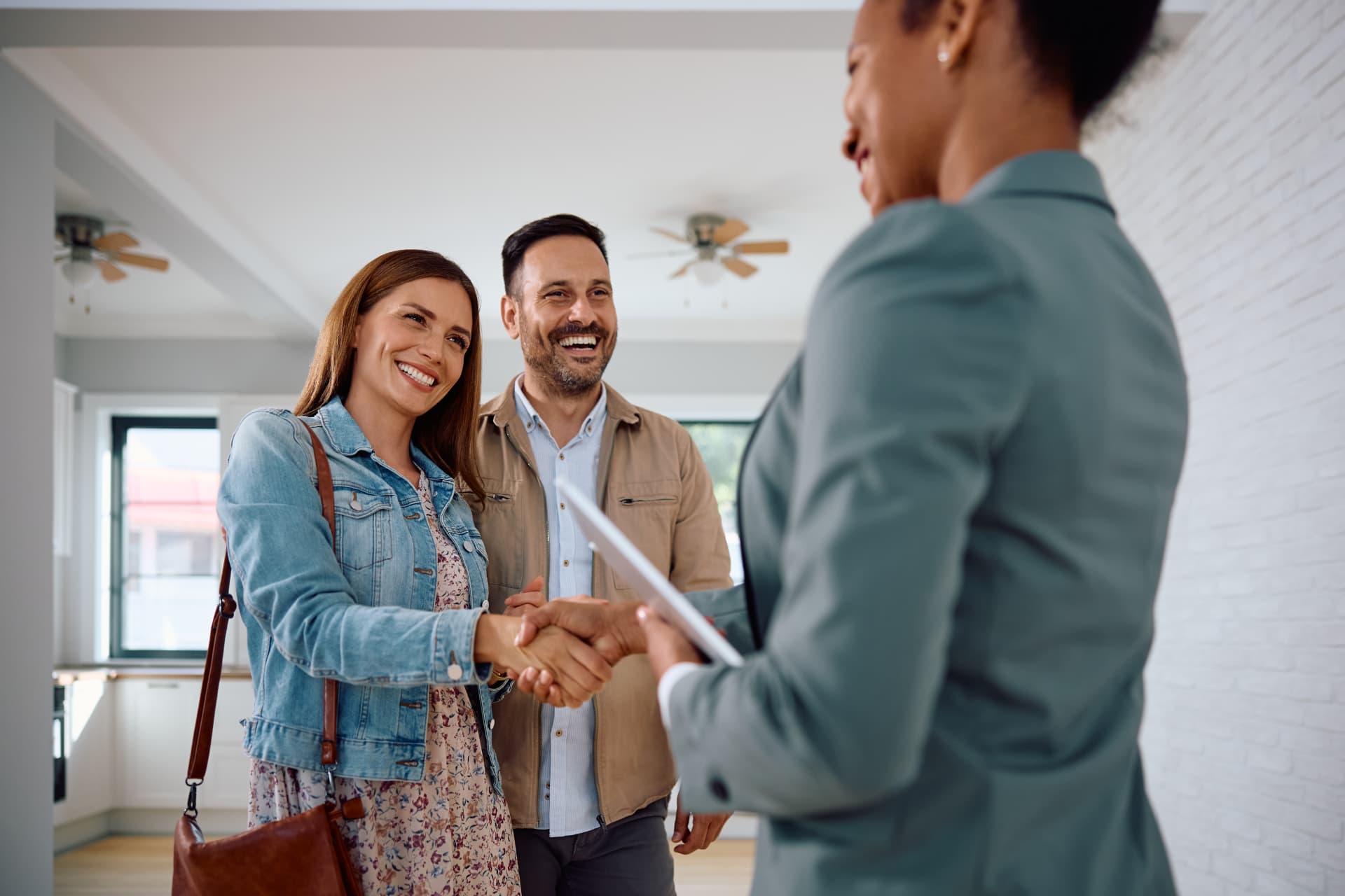 New Zealand real estate agent meeting with a client